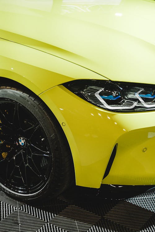 Close-Up Shot of a Yellow Car's Headlight
