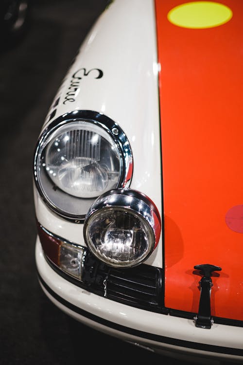 Free Red and White Car With Chrome Headlights Stock Photo