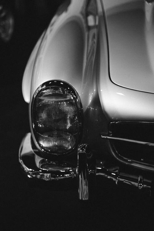 Free Close-up of a vintage car's headlight in black and white, showcasing retro design. Stock Photo
