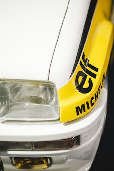 Close-up of a classic Renault 5 rally car showcasing its headlight and sporty design.