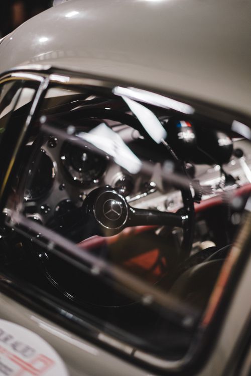 Free Detailed close-up of an elegant vintage car interior, showcasing the steering wheel and dashboard. Stock Photo
