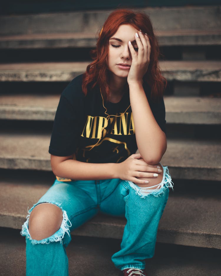 Woman In Black Shirt Sitting On Steps