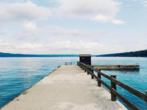 Free Peaceful view of a pier on Canandaigua Lake, perfect for serene moments. Stock Photo