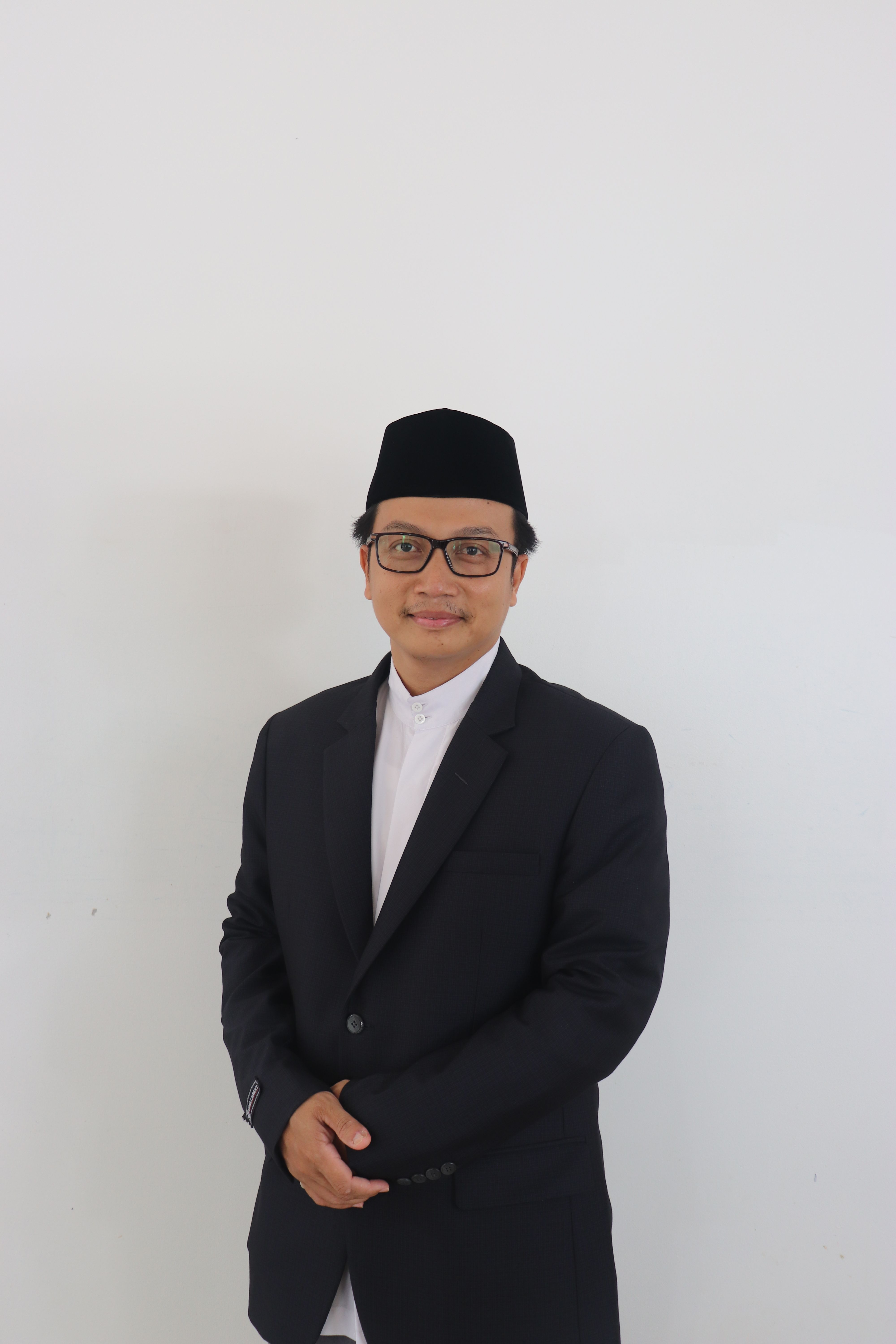 Man in Black Suit Jacket Wearing Black Cap