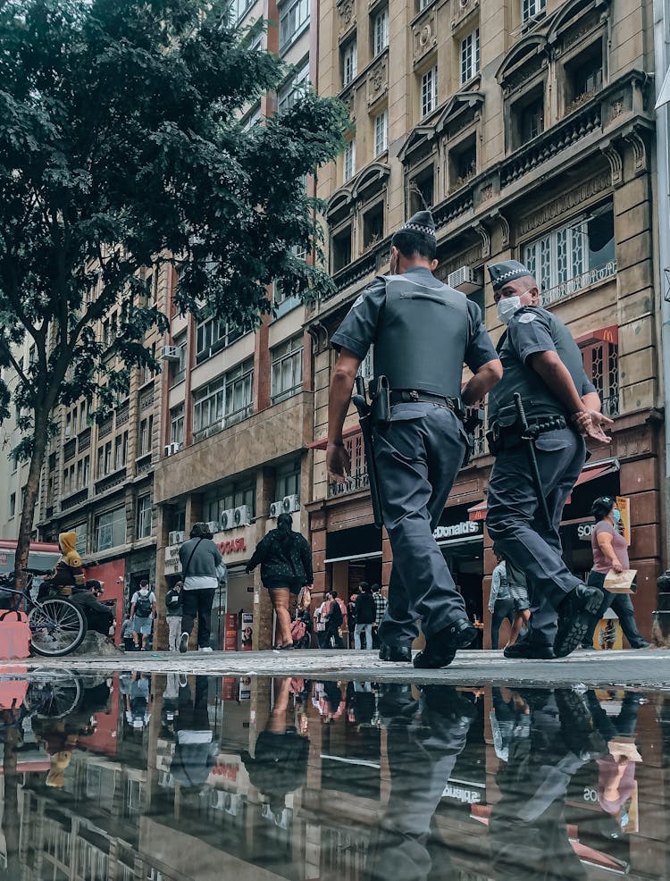 Police Officers Walking On Street