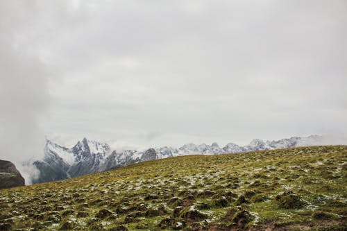 Green Grass Covering the Mountain Slope