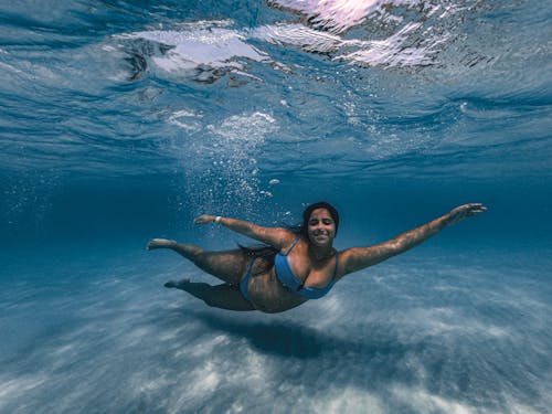A Woman Swimming Underwater