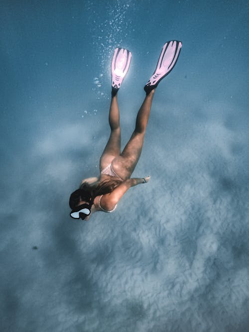 Woman in Black Bikini Under Blue Sky