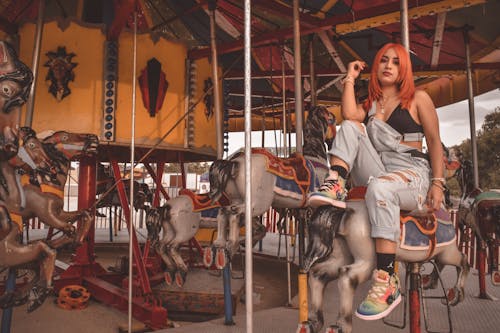 Woman Riding on Carousel