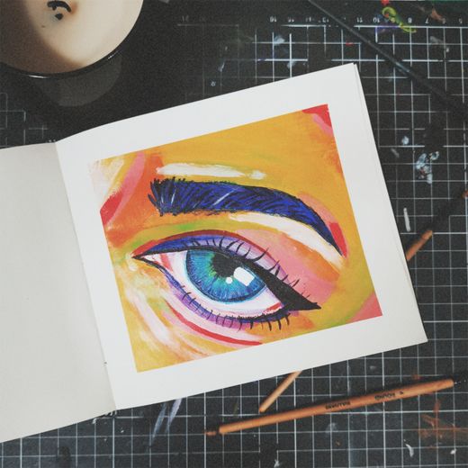 Eye illustration in an open sketchbook — photo by Alani Robertson on Pexels