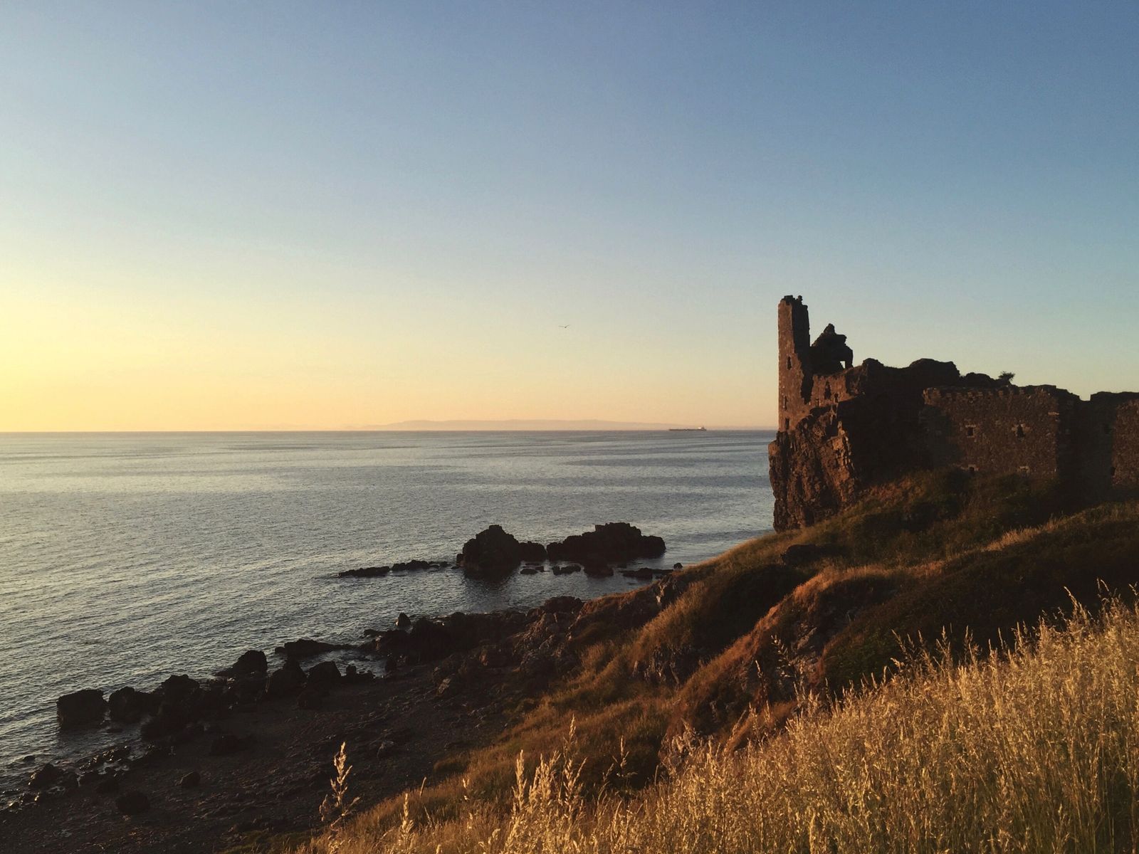 Dunure Castle overlooking the sea on the Ayrshire coast at sunset
