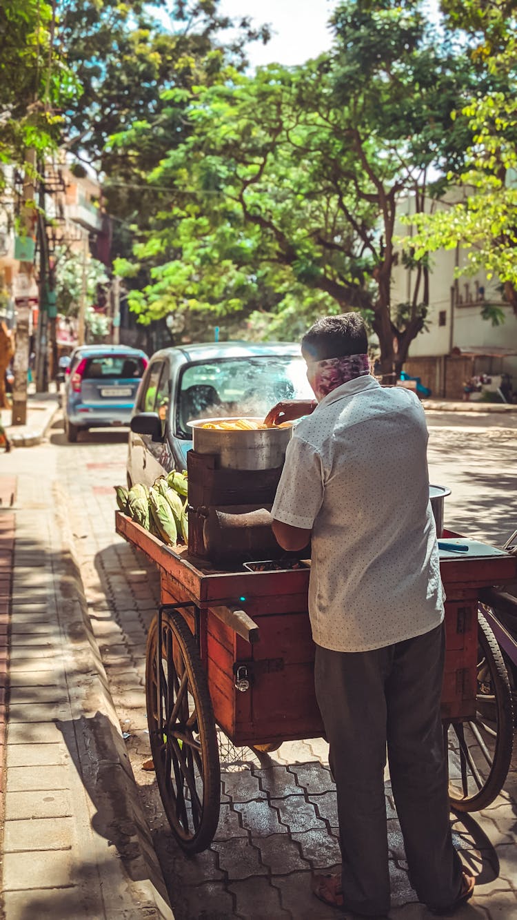 A Man With A Cart In A City