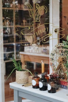 Elegant aromatherapy shop window with essential oil bottles and decor.
