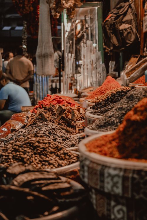 Free Explore the diversity of spices at this bustling market with a variety of aromatic condiments on display. Stock Photo