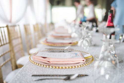 Free Menu Card and Table Napkin on Top of a Plate Stock Photo