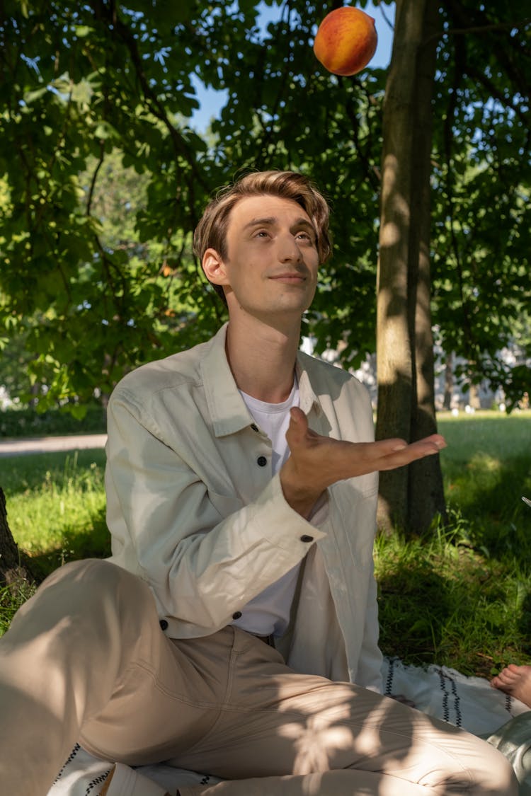 A Man Catching A Peach 