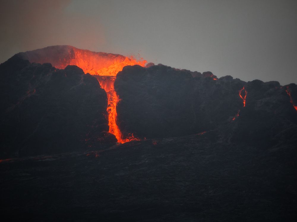 Molten lava cascading down the volcano side, DR Congo