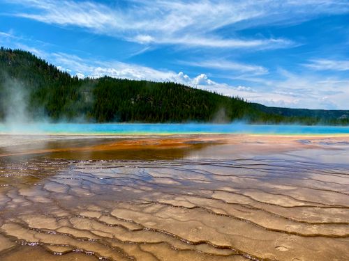 Free Stunning view of Grand Prismatic Spring in Yellowstone National Park with colorful mineral deposits and steam. Stock Photo
