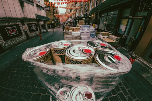 Close-up of Cans and Boxes in the City Street 