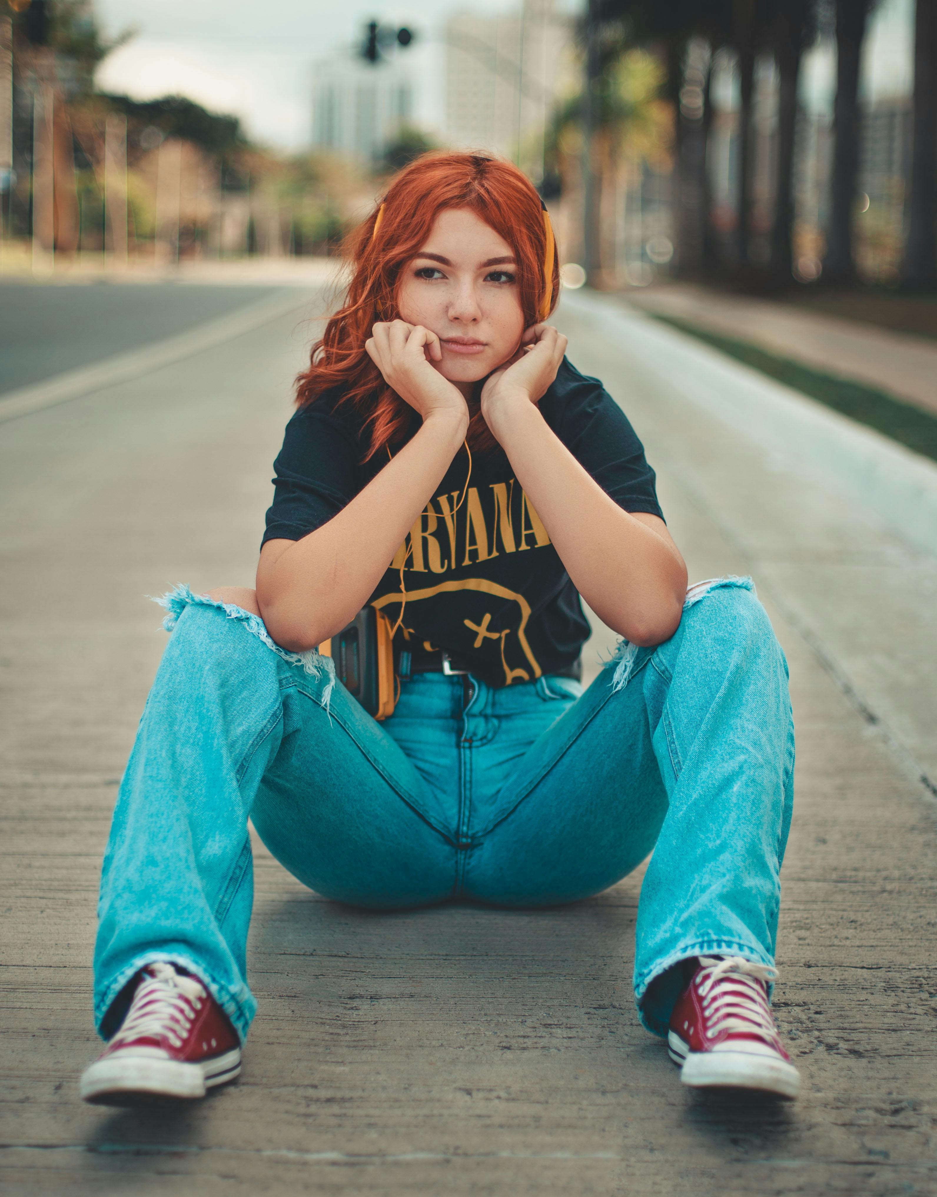 Person in Denim Jeans Sitting on the Floor · Free Stock Photo