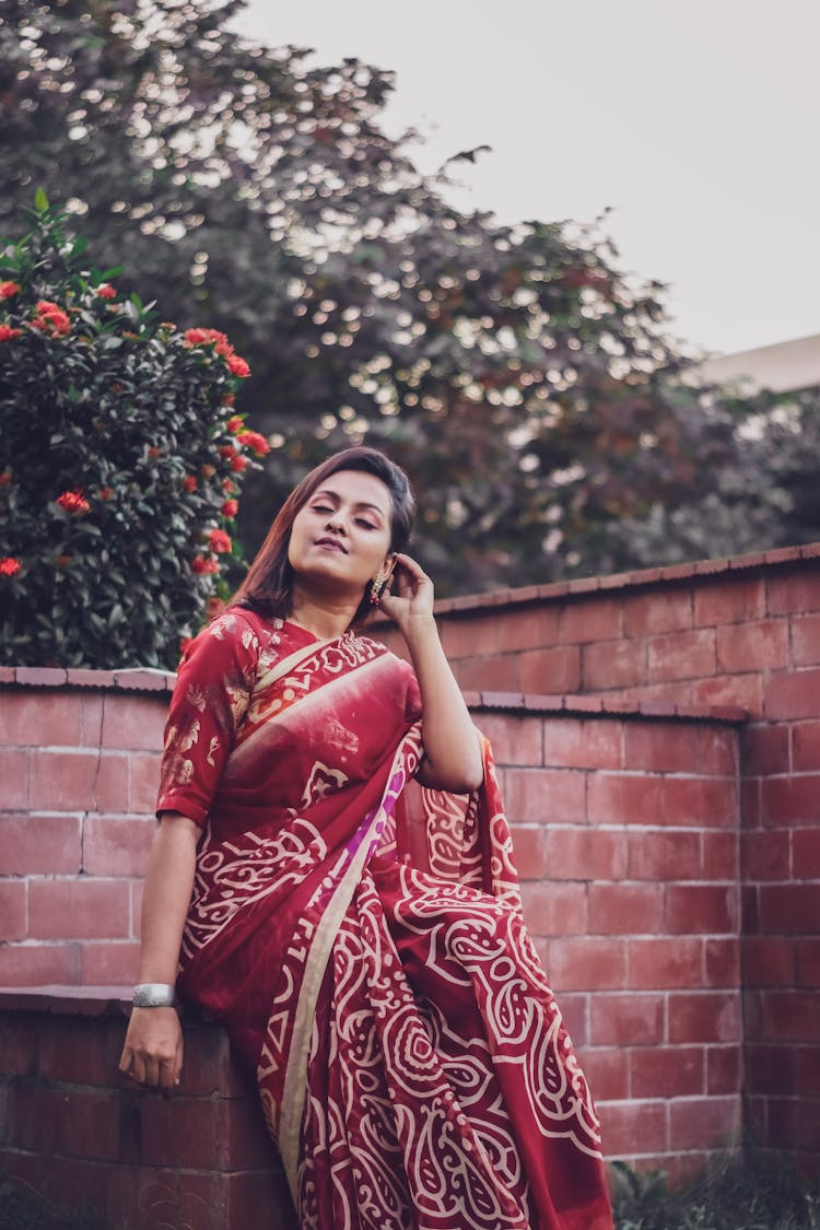 Woman Wearing A Red Sari 