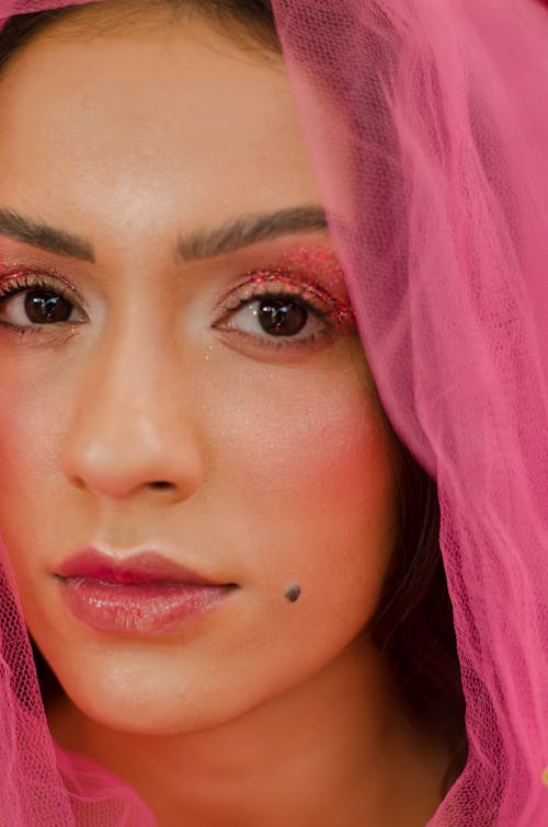 Close Up of a Woman on Pink Glitter Eye Shadow Makeup
