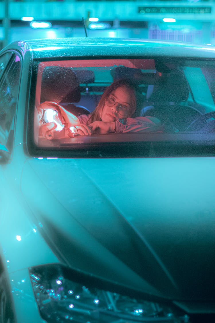 Tired Woman Sitting Inside The Car