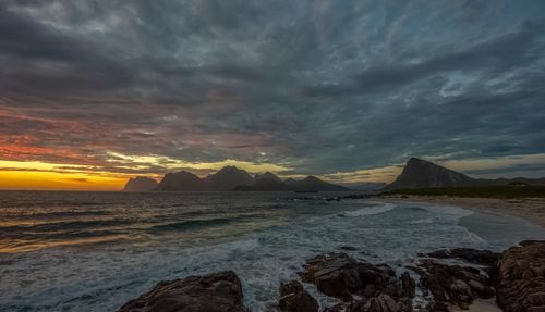Free Stunning sunset view of the rugged coastline in Storsandnes, Troms og Finnmark, Norway. Stock Photo