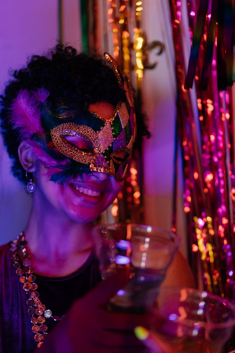 Photograph Of A Woman With A Mask Smiling