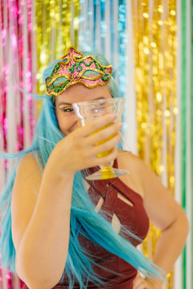 Photo Of A Woman With A Mask Holding An Alcoholic Drink