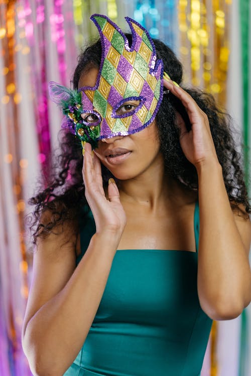 Woman in Green Spaghetti Strap Top With Mask