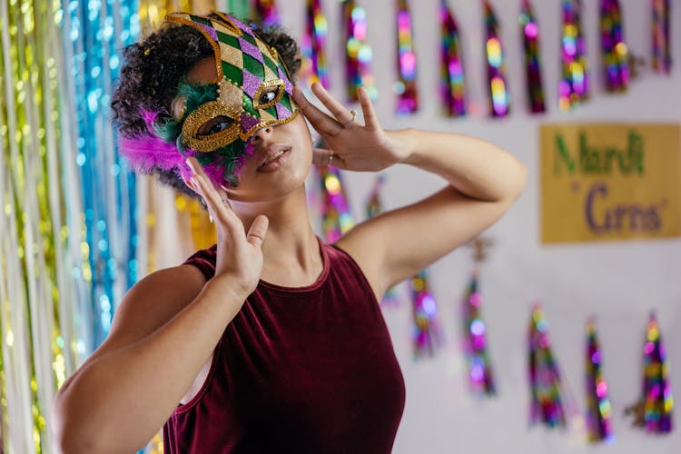 
Woman Wearing Mardi Gras Mask On Her Face


