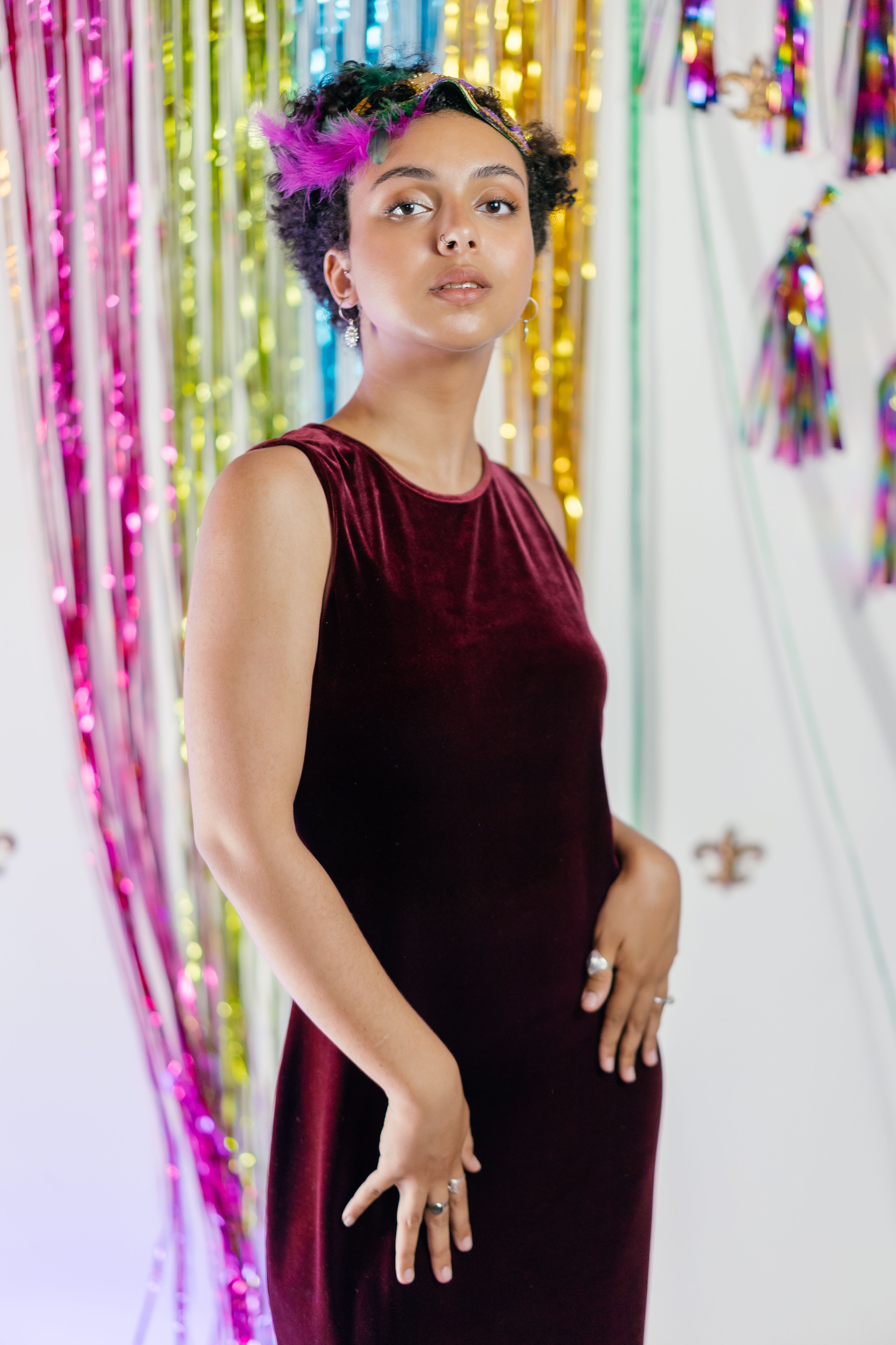 Woman in a burgundy velvet dress at a party