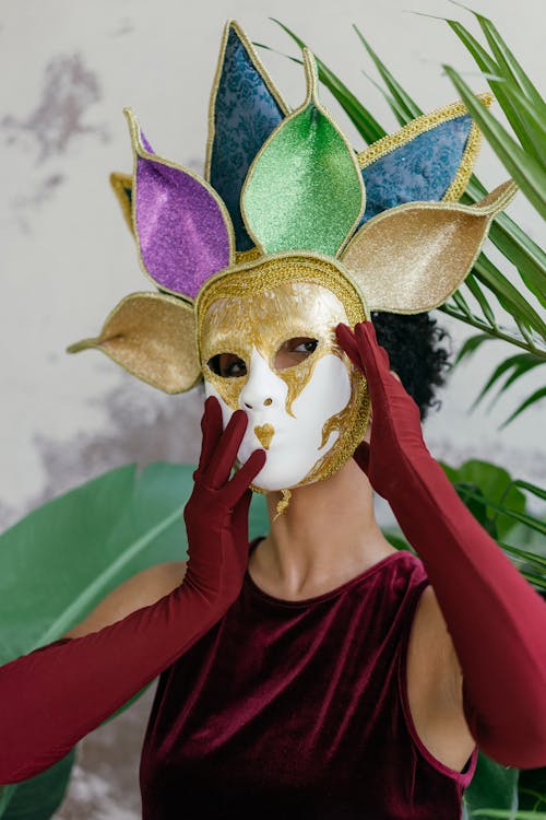 A Woman holding Masquerade Mask