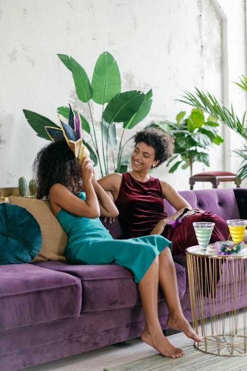 Friends Sitting Together on a Purple Couch