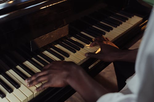 Close Up Photo of a Person Playing Piano