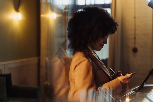 Woman in White Dress Shirt Holding Smartphone