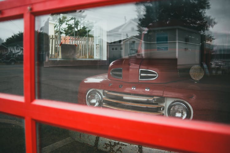 View Of The Vintage Truck Behind The Window 