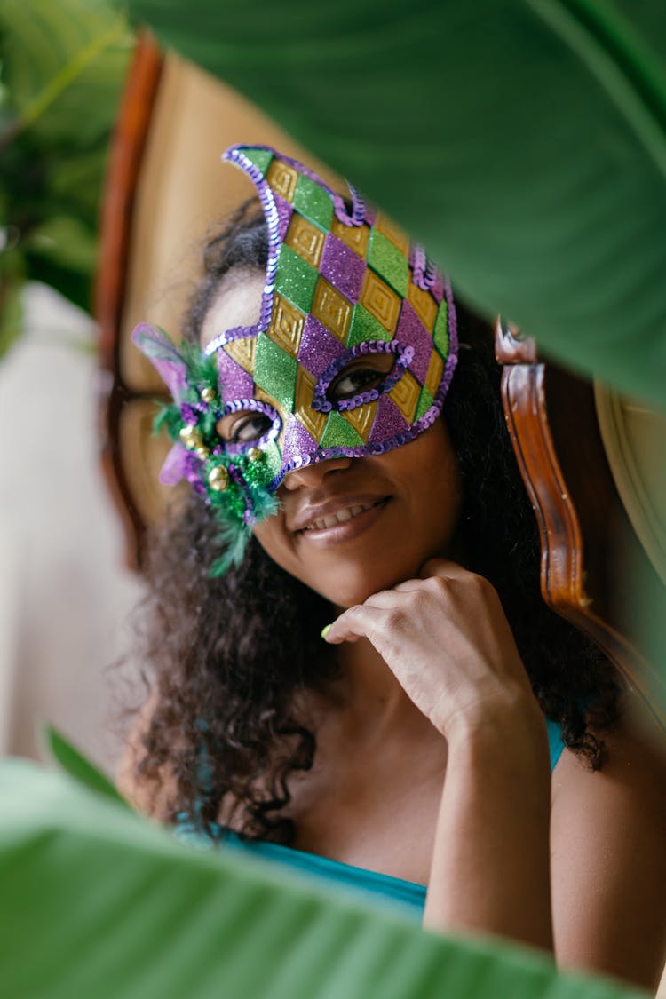 Portrait Of A Woman With A Mask Posing With Her Hand On Her Chin