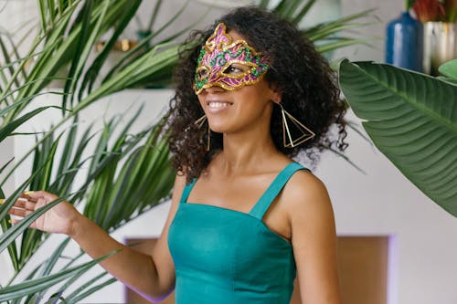Free Woman in Teal Dress Wearing Mask Stock Photo