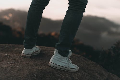 Free Person Wearing a Dirty Sneaker Stock Photo