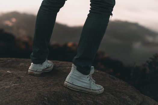 Person Wearing a Dirty Sneaker