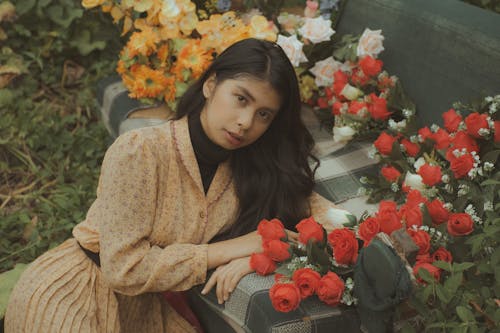 A Woman Posing with Roses