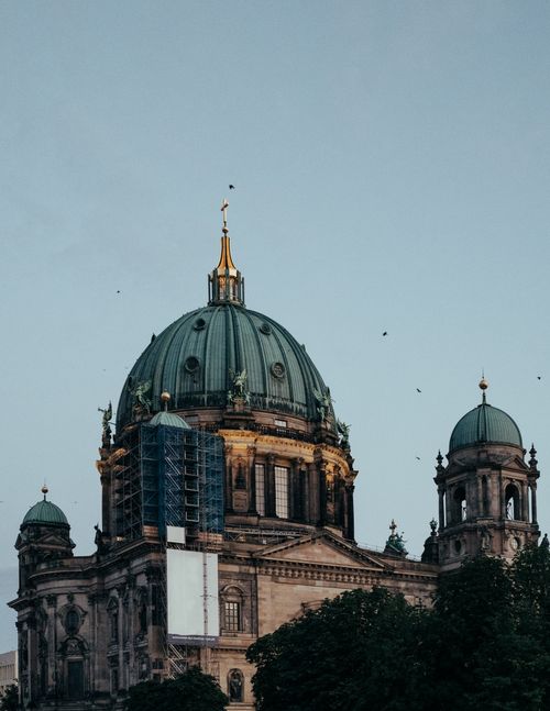 Free A stunning view of the Berlin Cathedral's dome under restoration during dusk, Berlin, Germany. Stock Photo