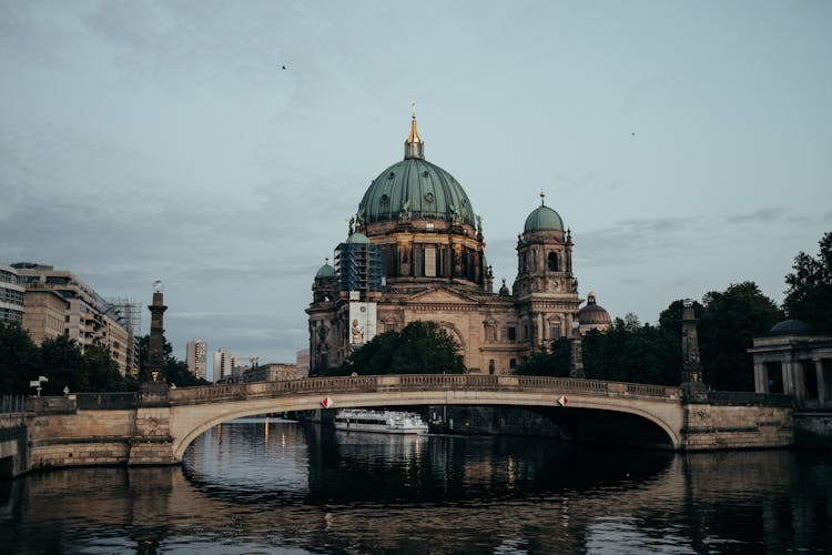 Brown And Green Dome Building Near Body Of Water