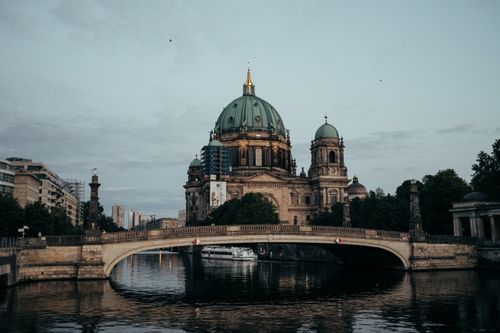 Free Scenic view of Berlin Cathedral over the Spree River at dusk, Germany. Stock Photo