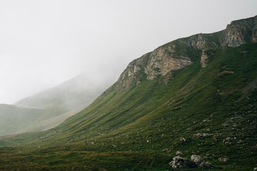 Free A serene view of a foggy mountain landscape in Switzerland, capturing nature's tranquility. Stock Photo