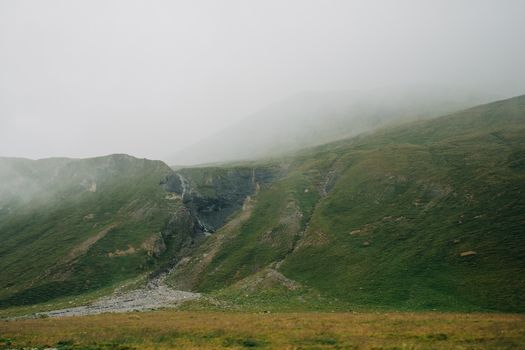 Green and Brown Mountains Under White Sky