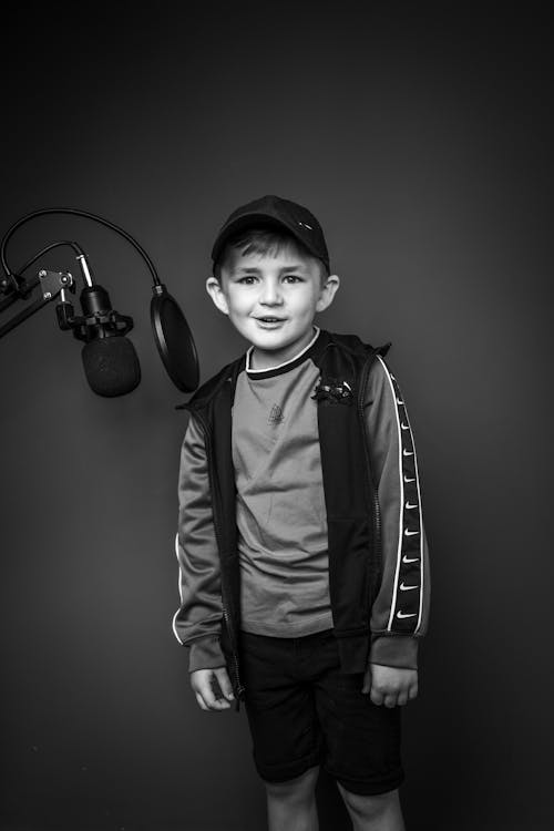 Free Black and White Photo of a Boy in a Recording Studio Stock Photo