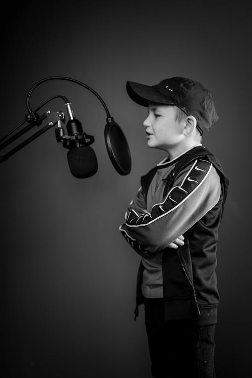 Boy Singing inside a Recording Studio
